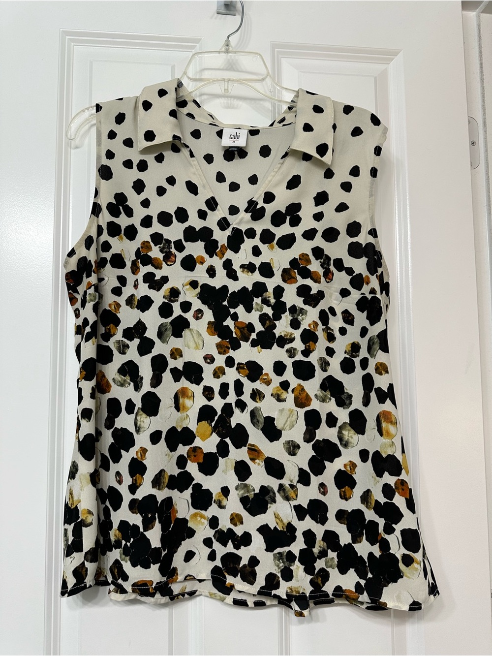 CAbi Sleeveless V-Neck Collared Animal Print Top in Cream, Black and Brown